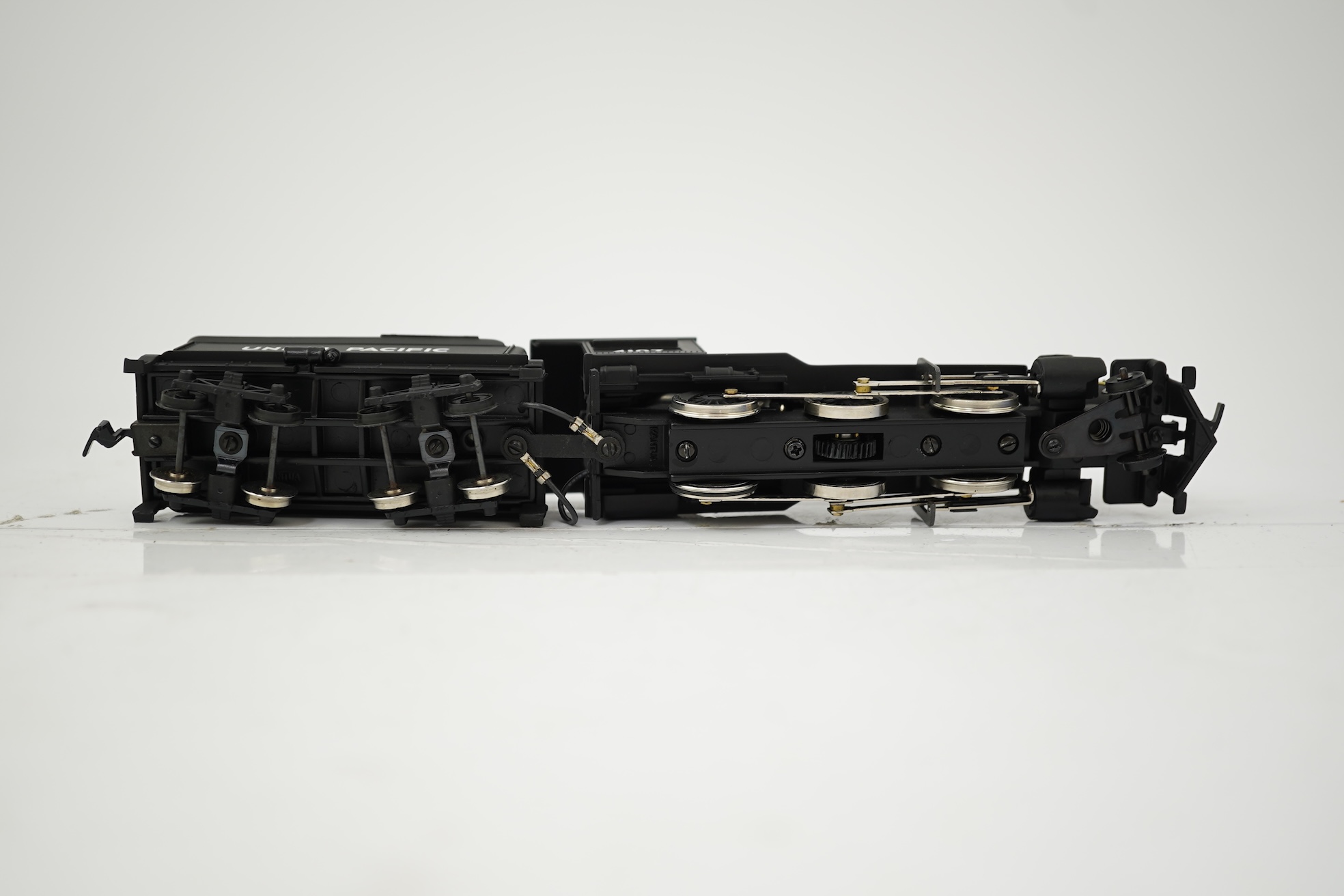 Two boxed HO gauge Union Pacific locomotives; a Genesis (G9008) model of USRA, 2495, 2-8-2 locomotive with bogie tender, together with a Mantua (313-003) 2-6-0 Mogul locomotive with bogie tender, both powered for two rai